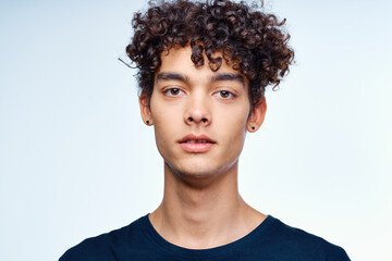 cute guy curly hair face close up skin care studio