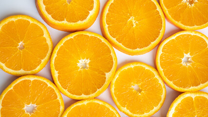 Perfectly sliced oranges on a gray plate. Half rings of oranges on plate. Saturated oranges are sliced on a plate