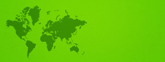 World map on green wall background. Horizontal banner