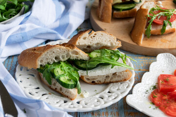 Summer cold sandwiches with fresh vegetables and goat cheese. Homemade healthy snack