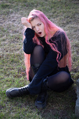 Beautiful girl with pink hair was very surprised and opened mouth, brought her hand to forehead