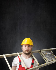 Portrait of a clumsy worker with ladder - obrazy, fototapety, plakaty