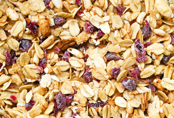 Close up of texture of granola with cranberries and no sugar. Healthy lifestyle and breakfast concept. Vegan and Vegetarian - Powered by Adobe