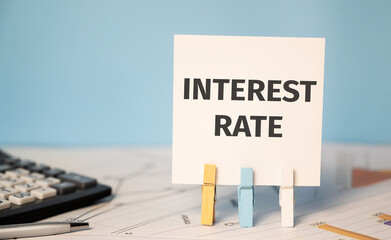 INTEREST RATE text near financial reports and calculator.Financial ans business concept.