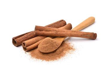 Aromatic cinnamon powder in spoon with sticks on white background.