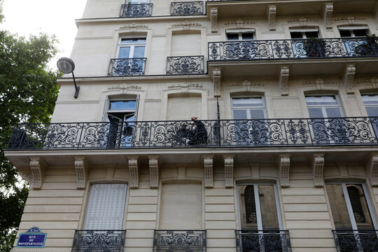 Man sitting on his balcony during lockdown in Paris, France.