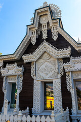 Vintage wooden rural russian house with beautiful carved window frames