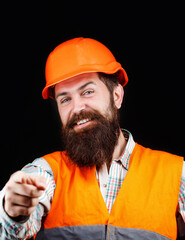 Bearded man worker with beard in building helmet or hard hat. Man builders, industry. Builder in hard hat, foreman or repairman in the helmet