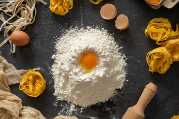 Closeup of process of making homemade pasta. Preparing the dough. Top view. 