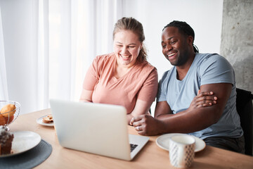 Couple feeling relieved and rested while having breakfast together