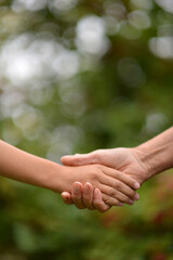 person holding granddaughter's hand