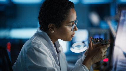 Modern Electronics Research and Development Facility: Beautiful Black Female Engineer Inspects...
