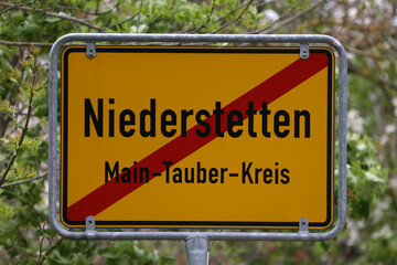Obraz premium Yellow Traffic Sign with Local Town Names. Niederstetten in Baden-Wurttenberg, Germany.