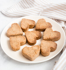 homemade heart-shaped cookies on a plate, Valentine's day gift with love, gluten-free buckwheat flour pastries