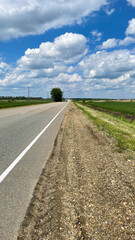 Fototapeta premium road, panorama, road, asphalt, sky, outdoor, landscape, nobody, horizon, landmark, view, travel, path, cloud, panoramic, surface, transport, light, space, nature, summer, trip, tourism, cloud landscap