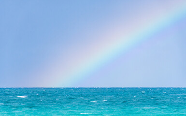 Rainbow on a cloudy day at the beach