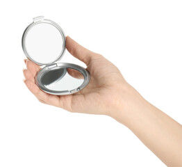 Woman holding grey cosmetic pocket mirror on white background, closeup