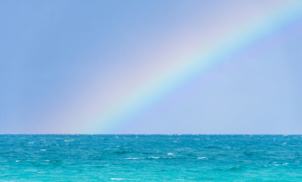 Rainbow on a cloudy day at the beach