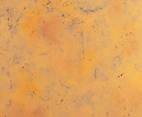 Orange grunge concrete wall close-up. Rusty abstract backdrop.