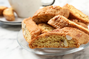 Traditional Italian almond biscuits (Cantucci) on white table, closeup
