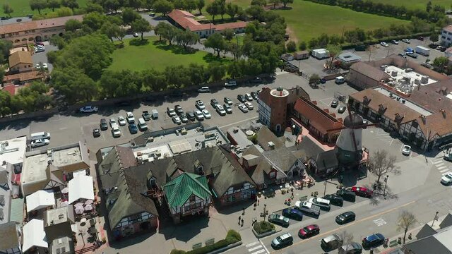 Aerial view over the store fronts and windmill in Solvang, California.