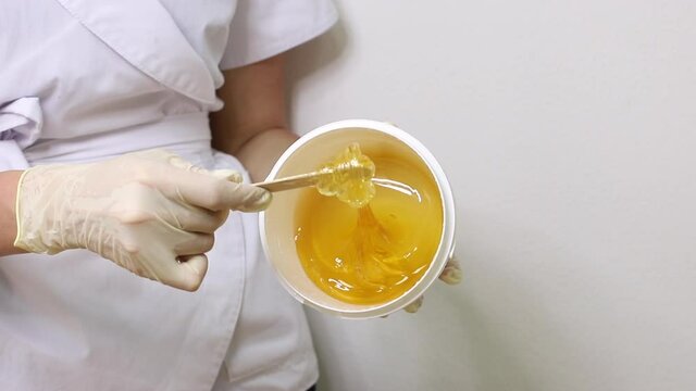 sugar for depilation of legs. shugaring feet in the salon.