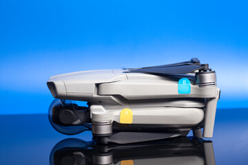 quadcopter drone aerial camera on blue background
