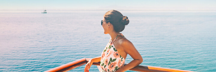 Cruise ship travel vacation woman looking at ocean from balcony of yacht deck. Luxury exotic...