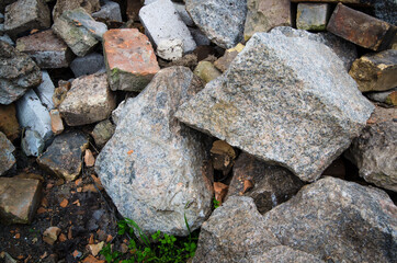 large granite stones lie on the street