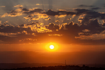 Sunrise with hot colors and flare