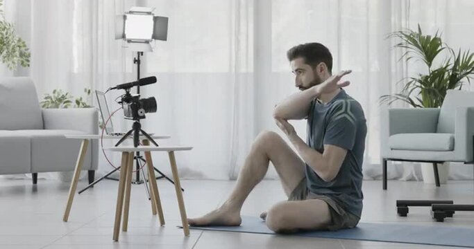 Professional personal trainer recording a video