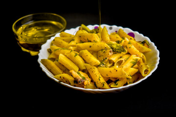 Penne pasta with chicken and olive oil. Italian food
