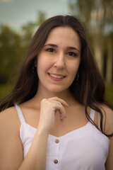 Obraz premium Smiling pretty woman outdoors.