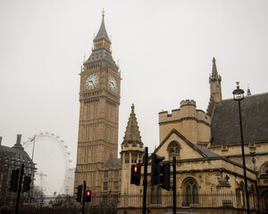 Fototapeta na wymiar London, UK - February 4, 2017: Juxtaposition of the Big Ben with the London Eye. Geometric view