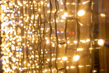 yellow wall garland perspective close-up soft focus. Festive blurred backdrop.