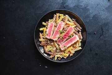 tuna pasta seafood spicy fusilli roasted fish fried grilled second course meal snack copy space food background rustic top view