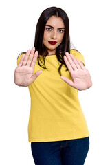 Studio photography of Brazilian woman in elegant yellow blouse and smiling, isolated on white background. Beautiful female model with white background