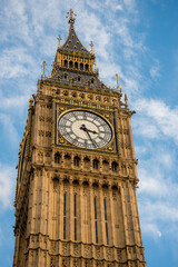 Fototapeta na wymiar London, UK - February 4, 2017: Close up detail view of the Big Ben clock tower where you can see the time and the unique structure of the iconic architecture.
