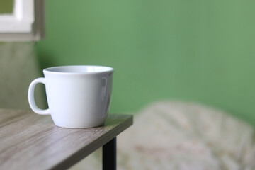 Cup of tea or coffee on a table. Selective focus.
