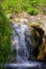 Water rushes down a waterfall.