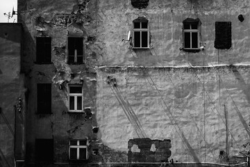 Facade of a decaying building in a small town in Poland