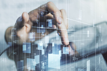 Double exposure of abstract creative statistics data hologram with finger clicks on a digital...