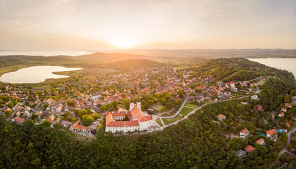 Aerial panoramic view of the famous Tihany - Hungary near the Balaton lake, including the Benedictine Monastery of Tihany (Tihany Abbey, Tihanyi Apatsag) during sunset - obrazy, fototapety, plakaty