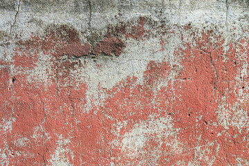 Fragment of an old peeling cracked texture of a concrete wall
