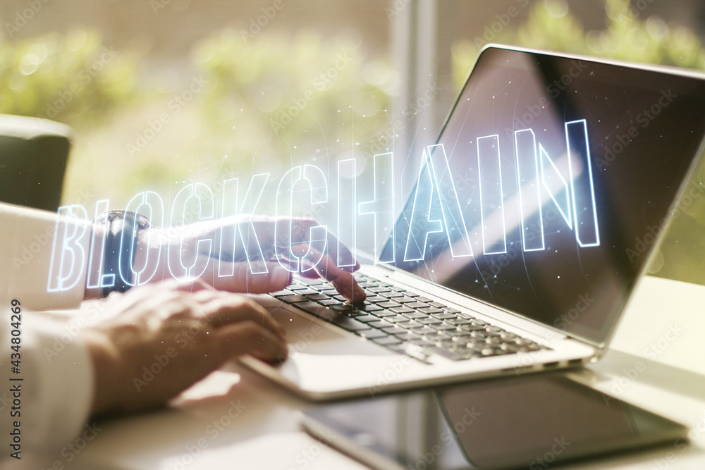 Poster double exposure of blockchain technology hologram and hands typing on laptop on background. research