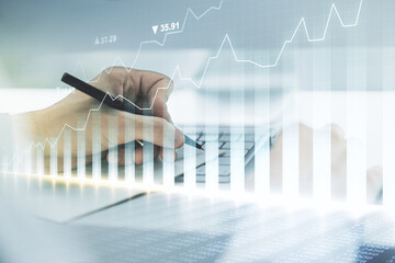 Multi exposure of abstract creative financial chart with hand writing in diary on background, research and analytics concept