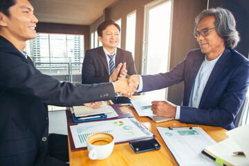 Serious business organizations gather to negotiate meetings led by older businessmen to discuss, offer solutions to current problems.