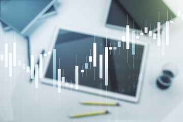 Abstract creative financial graph and modern digital tablet on background, top view, forex and investment concept. Multiexposure