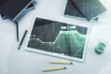 Double exposure of abstract creative statistics data hologram and modern digital tablet on background, analytics and forecasting concept