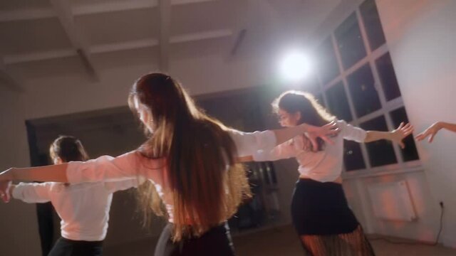 Girls in black skirts are dancing in the studio. Dance rehearsal. Dance staging.